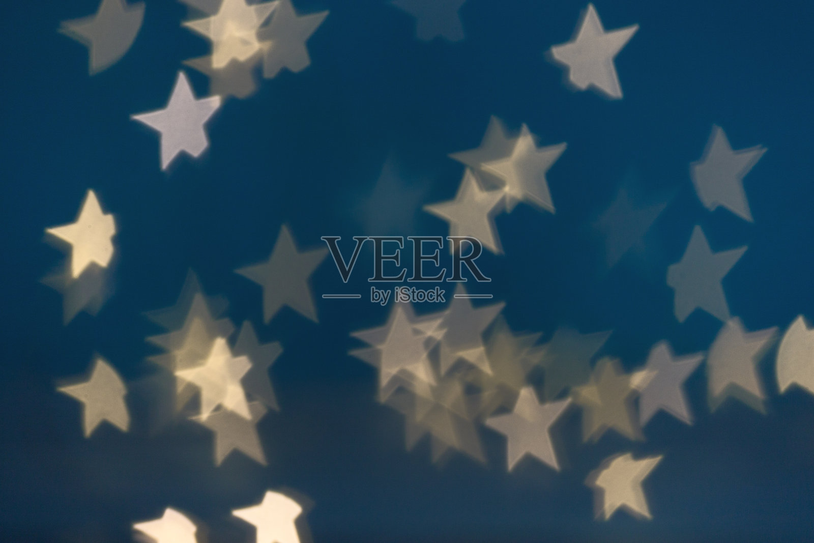 金色星光散景背景。圣诞节的抽象模式。照片摄影图片