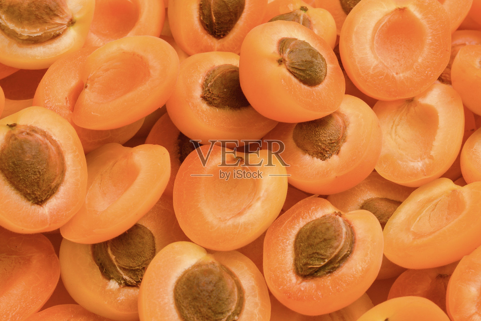 成熟多汁的橙杏切片水果背景。照片摄影图片
