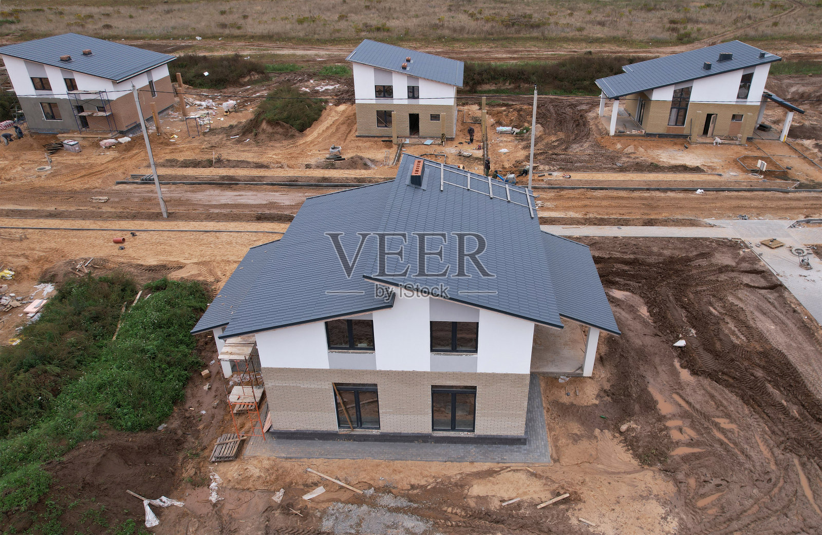 陶粒砌块住宅建筑。建筑工地上有一座乡村别墅。照片摄影图片