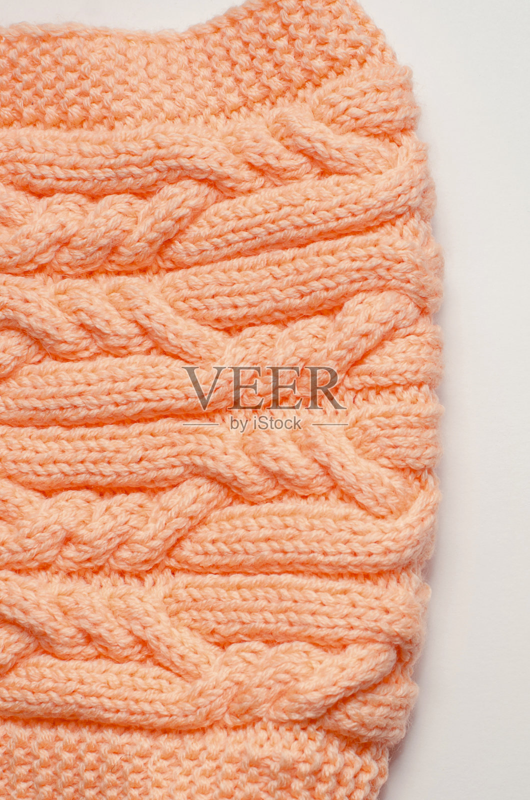 编织的温暖的围巾。特写镜头,摄影垂直。照片摄影图片