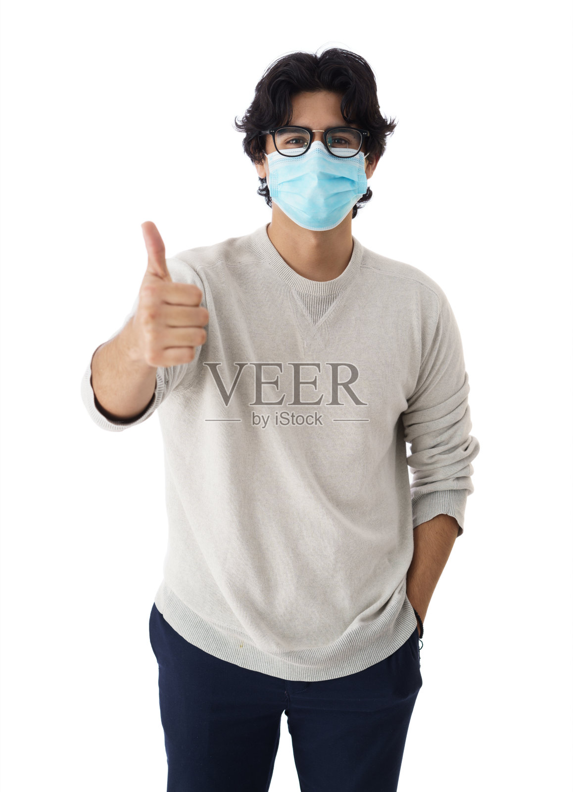 戴着面具的年轻人竖起大拇指照片摄影图片