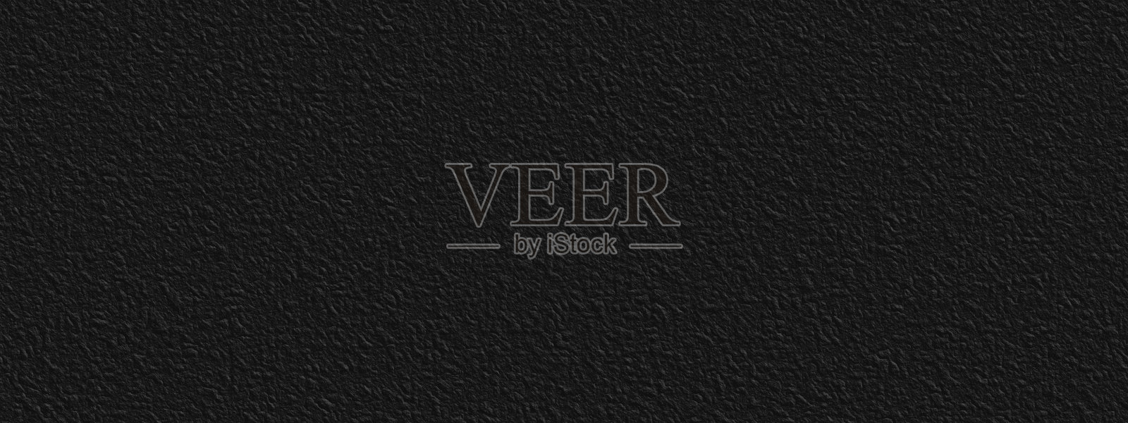 抽象的黑色石墙、背景——以粗糙浮雕的形式呈现石材表面照片摄影图片