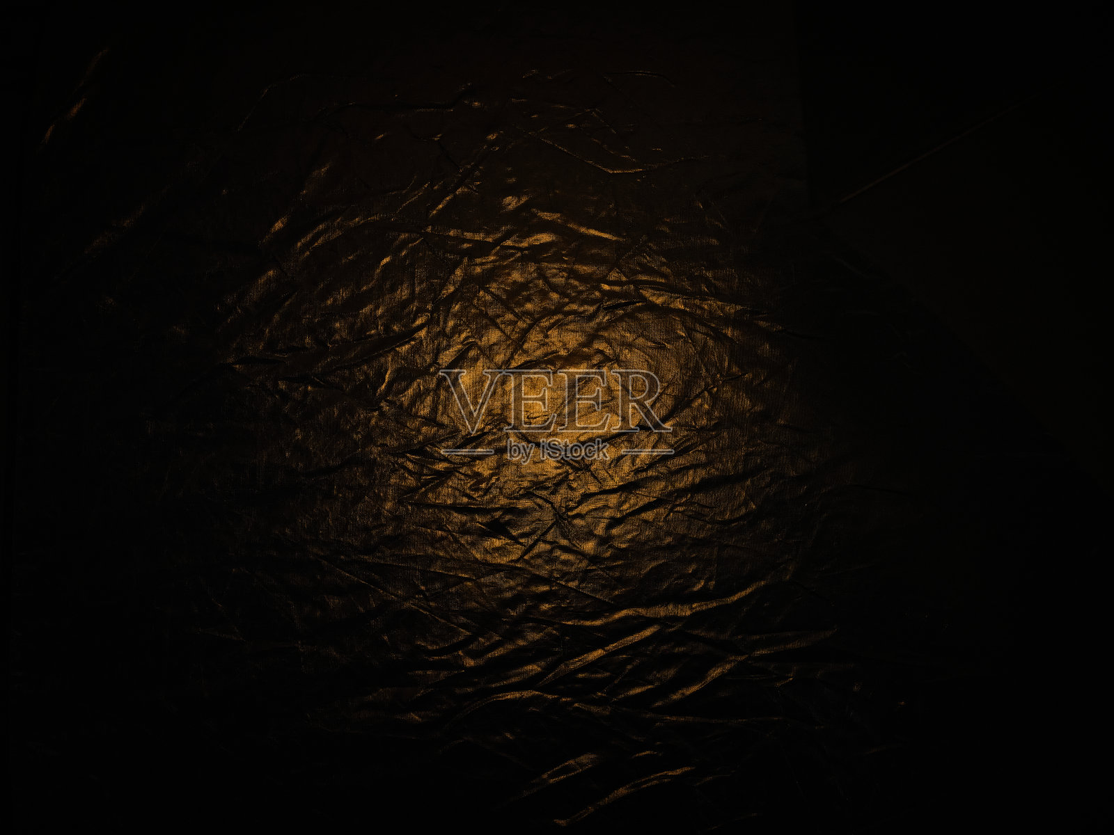 背景与皱纹的表面,小品超过金色的光照片摄影图片