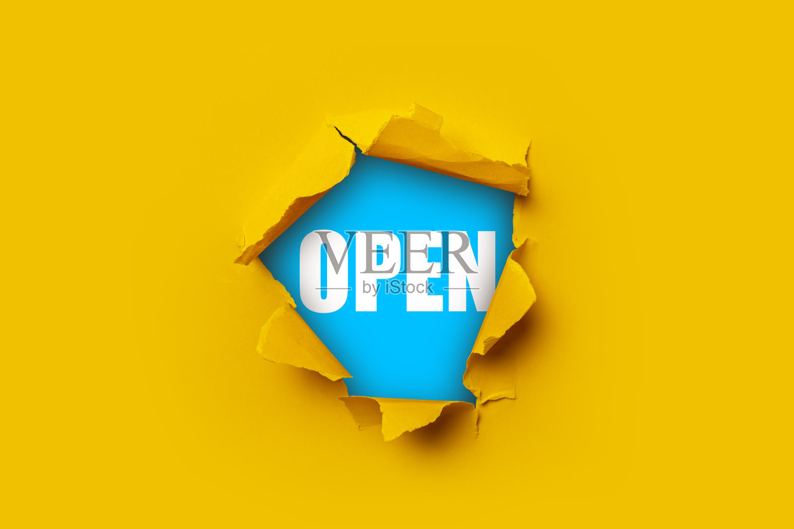 在蓝色的背景上写着“打开”的字样。照片摄影图片