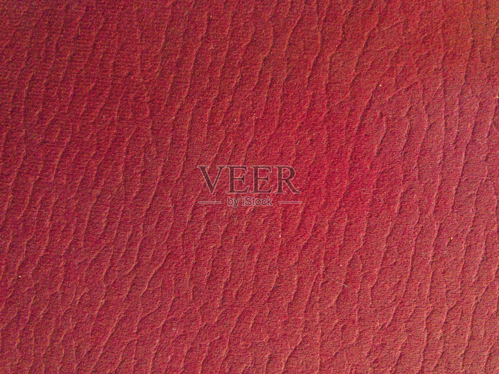 红色织物作为纹理或背景的红色织物照片摄影图片