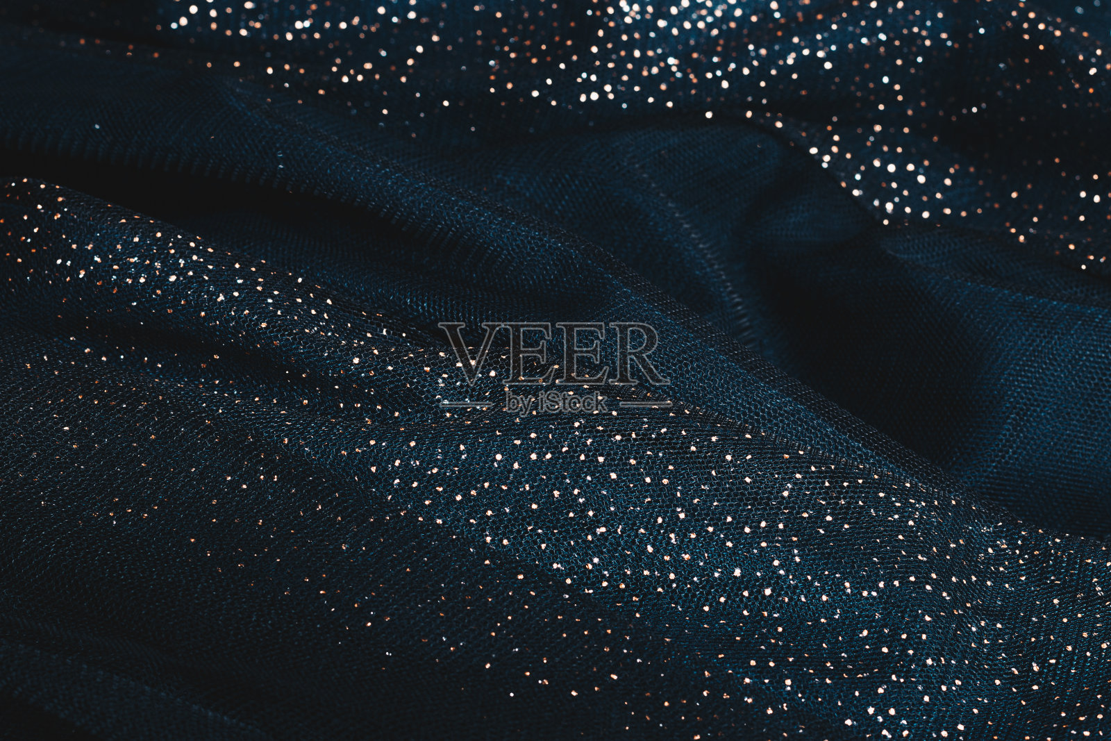 带有亮片的深绿色织物照片摄影图片