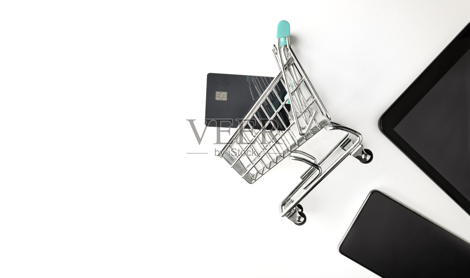背景与互联网购物的概念与购物车,银行卡和设备照片摄影图片