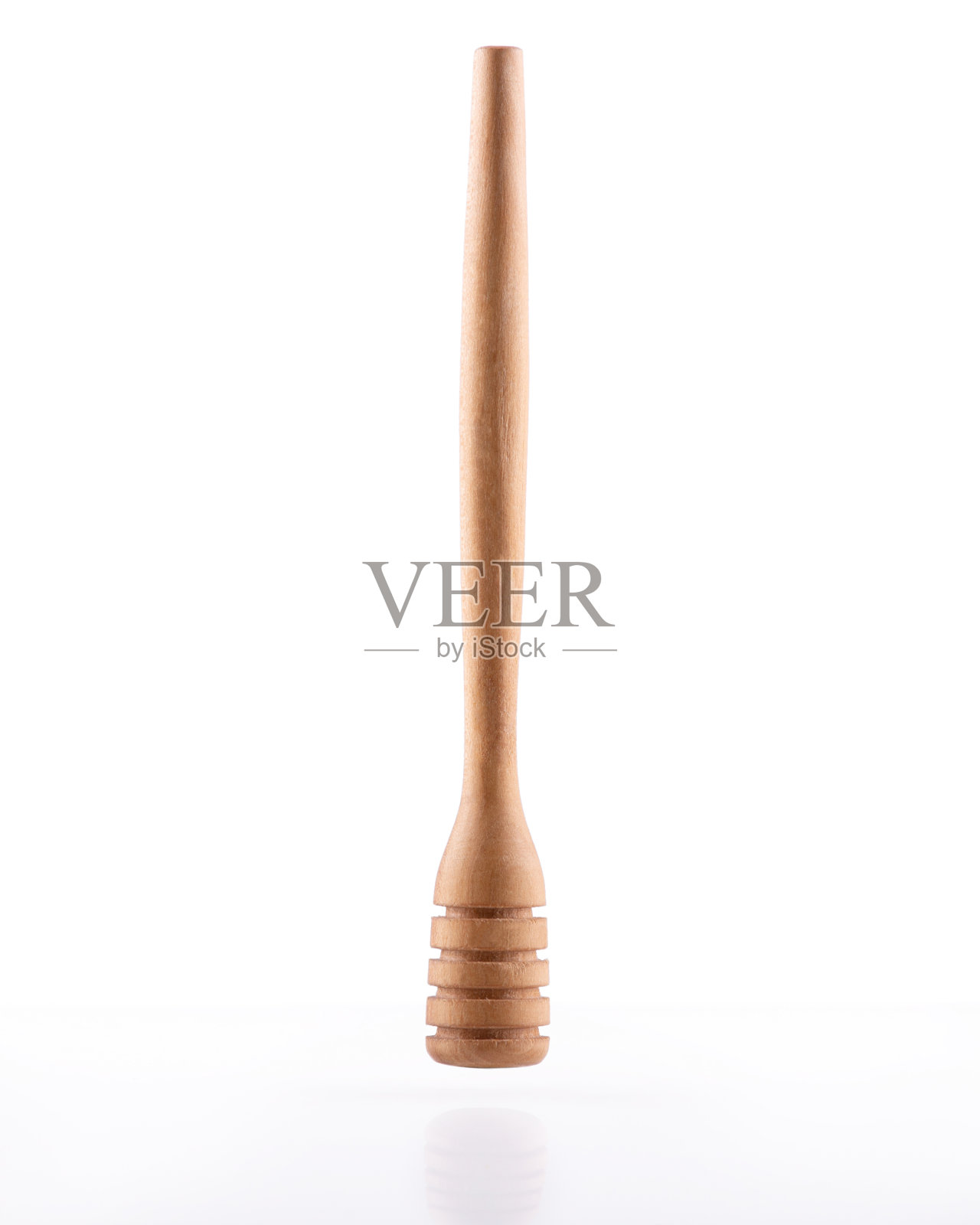 木勺蜂蜜纺锤在孤立的白色背景照片摄影图片