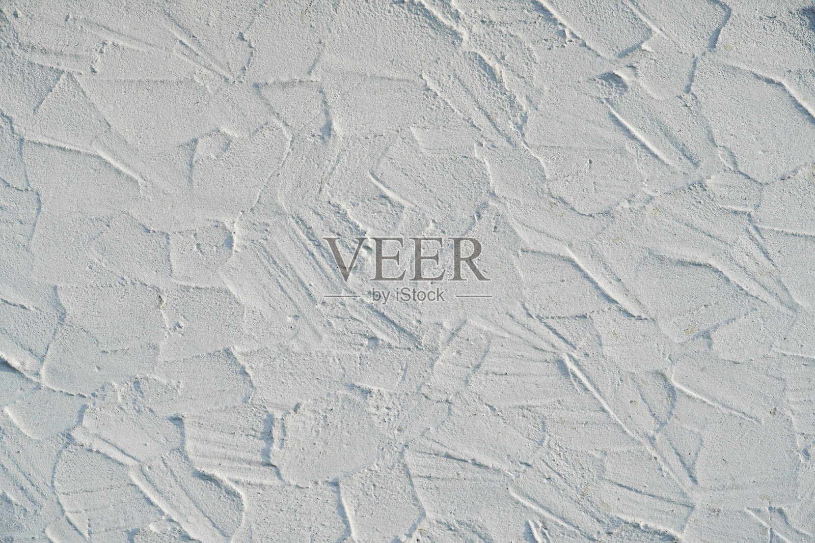 凌乱的灰泥墙,漆成白色。背景和纹理。照片摄影图片