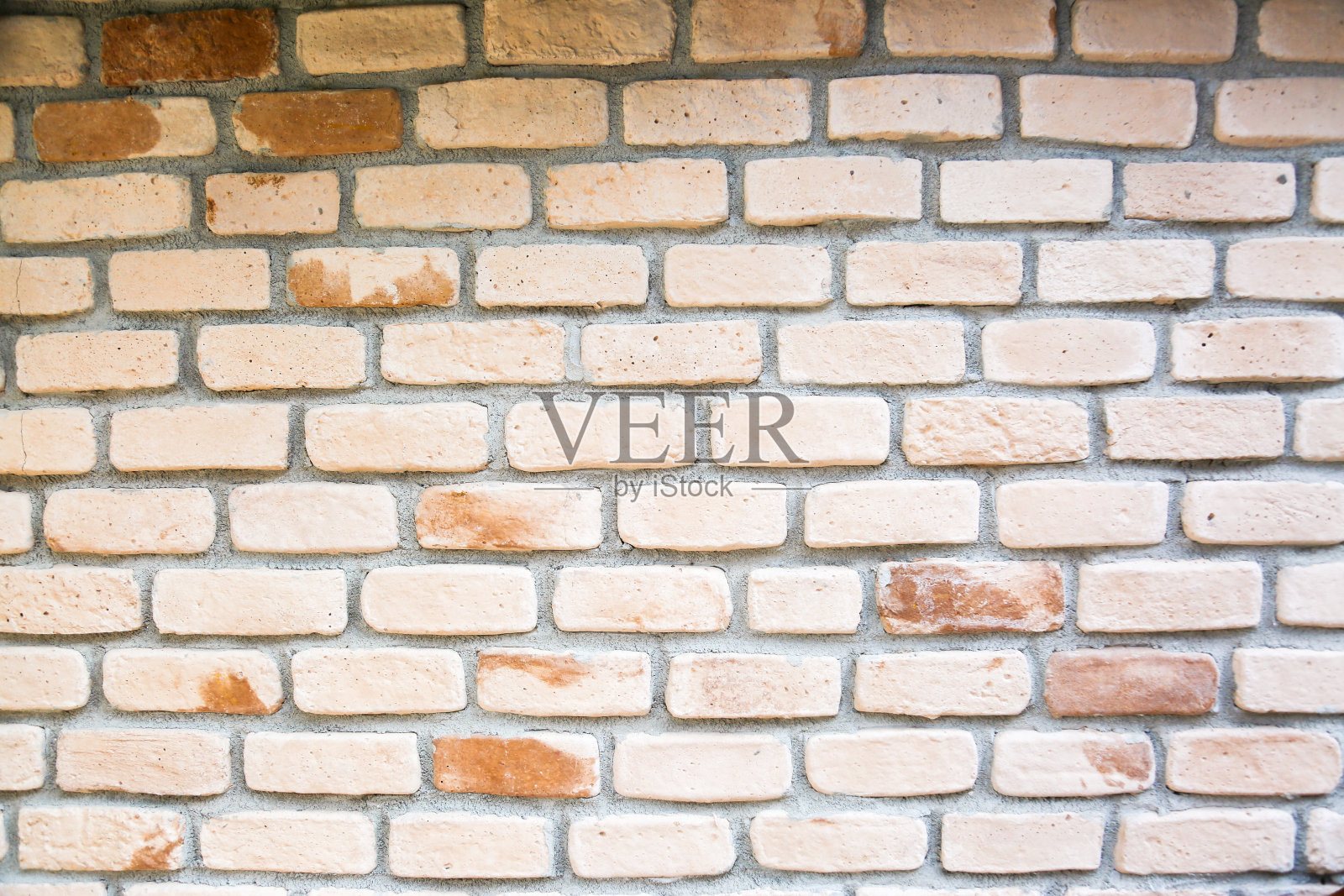 米色砖墙纹理背景。照片摄影图片