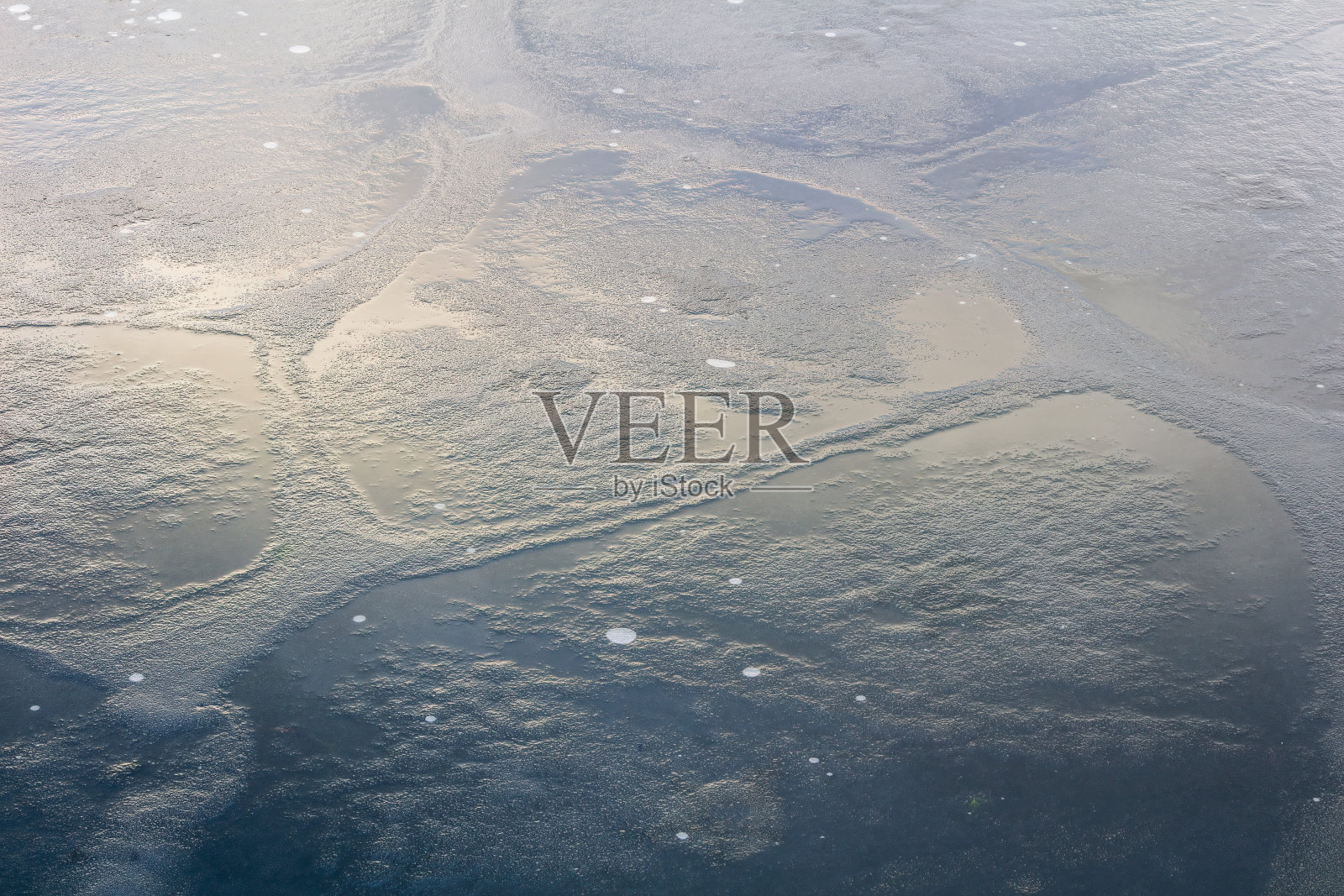 冬季池塘上的冰纹理。曲棍球,运动背景照片摄影图片