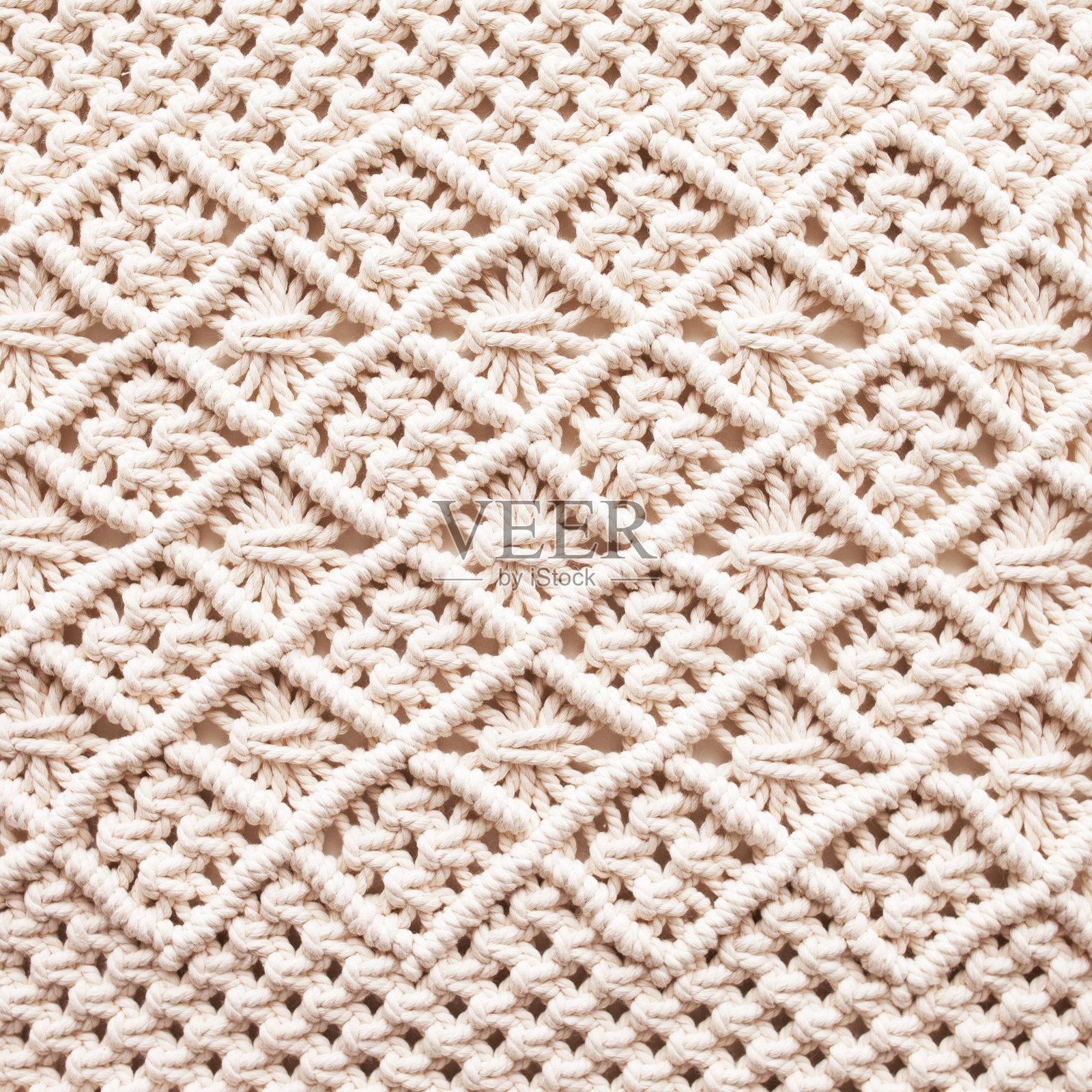 手工刺绣的。编织及棉线。女性的爱好。环保现代编织DIY室内自然装饰理念。全棉墙面装饰。照片摄影图片