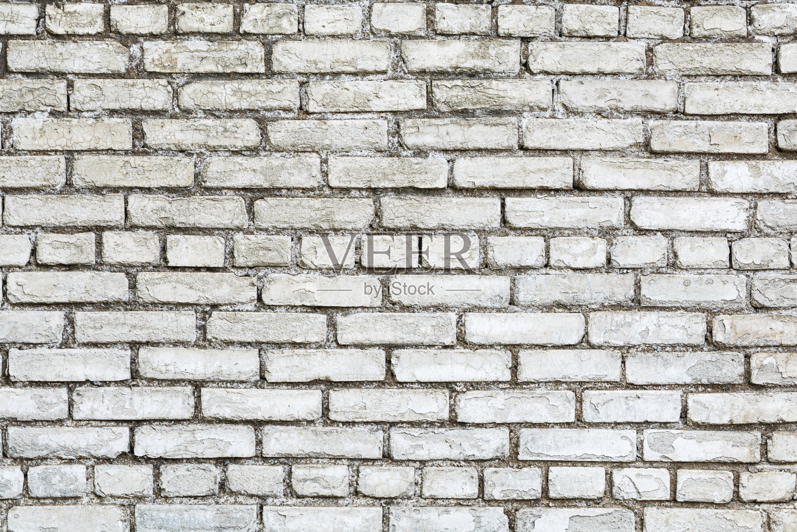 旧白墙,由碎裂的旧砖砌成,作为背景照片摄影图片