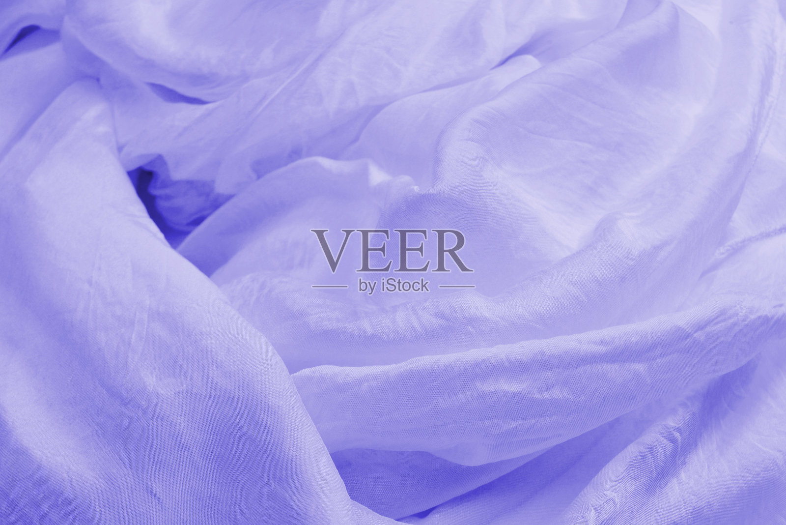 紫色丝绸或绸缎豪华面料质感可作为抽象背景。照片摄影图片