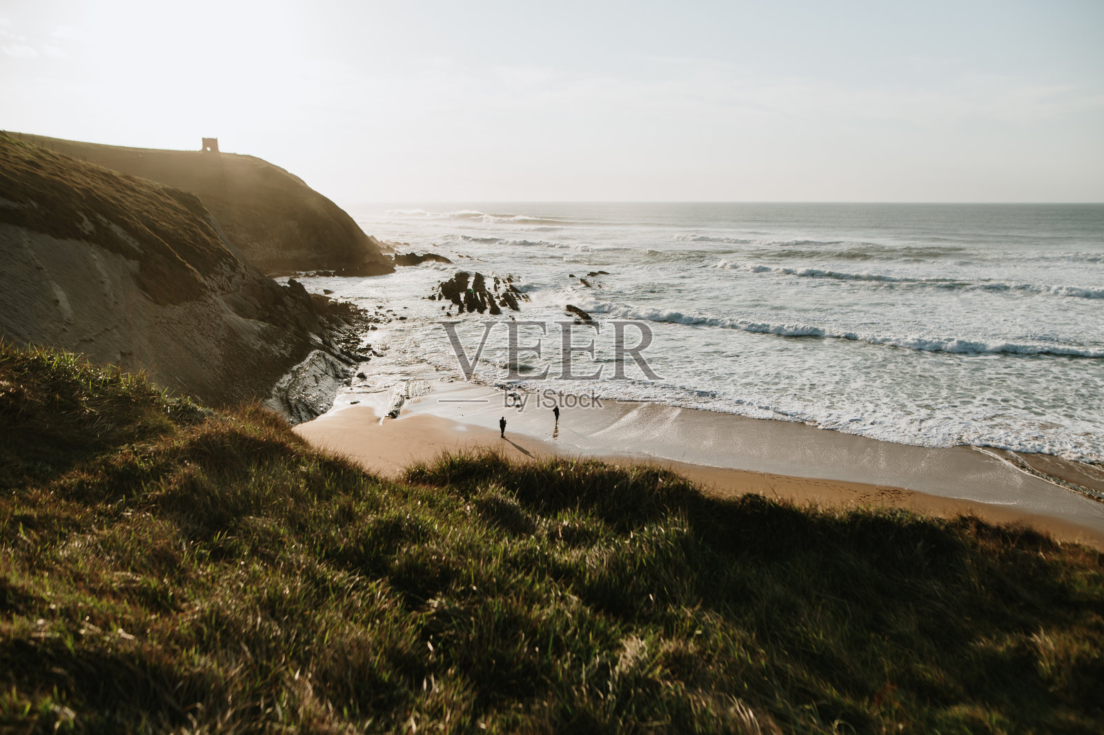海滩日落时照片摄影图片
