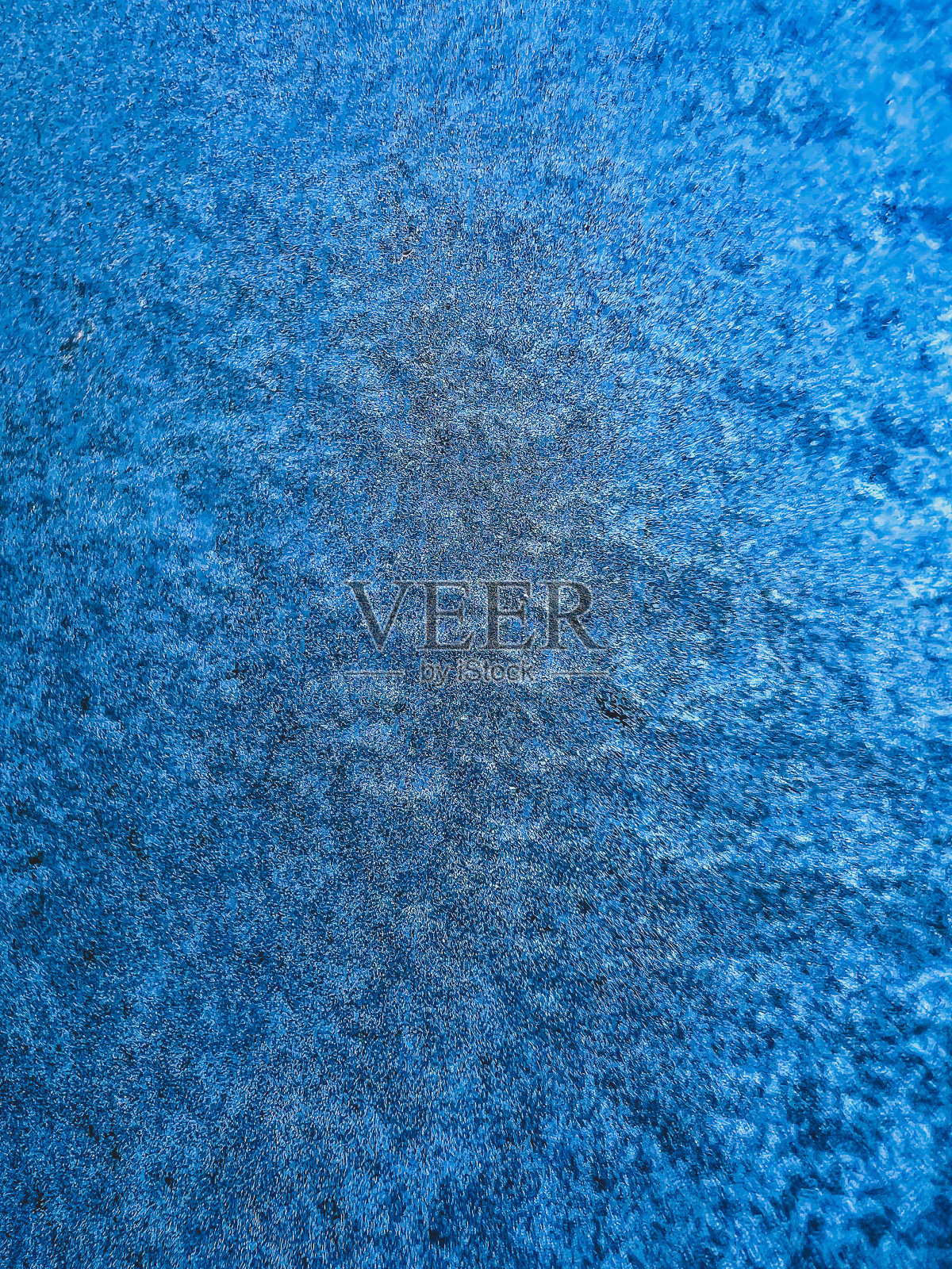 一块结了冰的窗玻璃。照片摄影图片