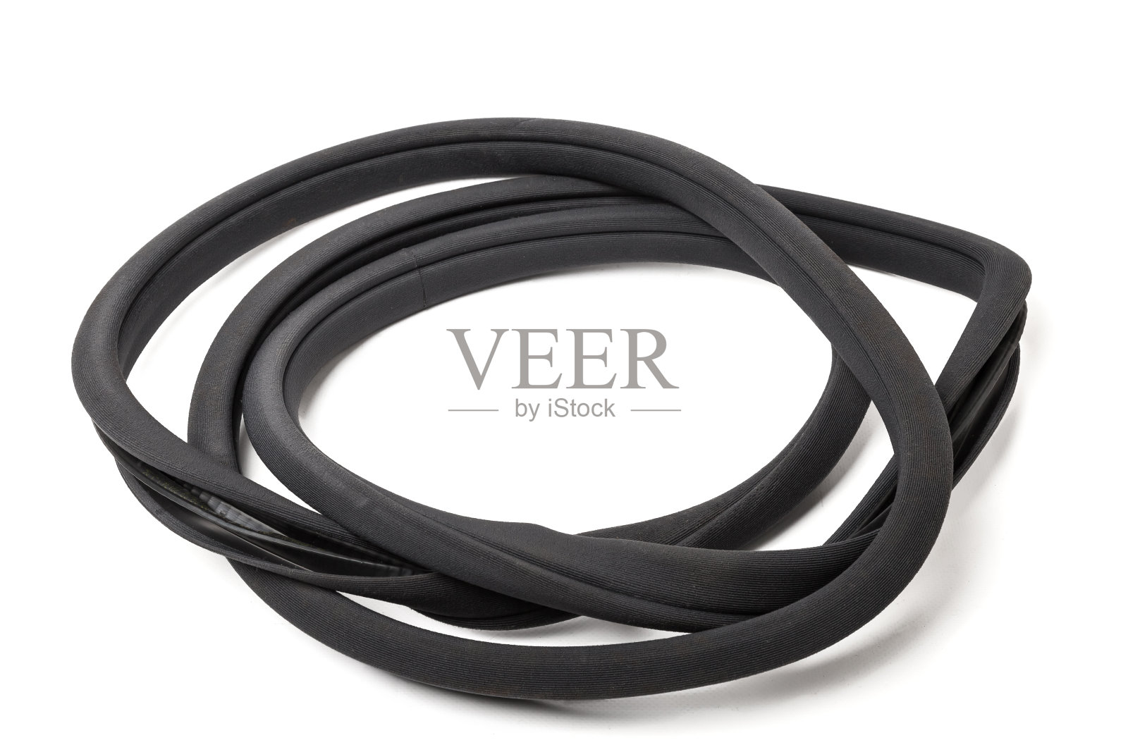 卷起的黑色橡胶密封胶用于车身、车门或后备箱的部件,用于隔音、隔热和隔音,防止热在汽车内部流失。车间维修用密封垫片照片摄影图片