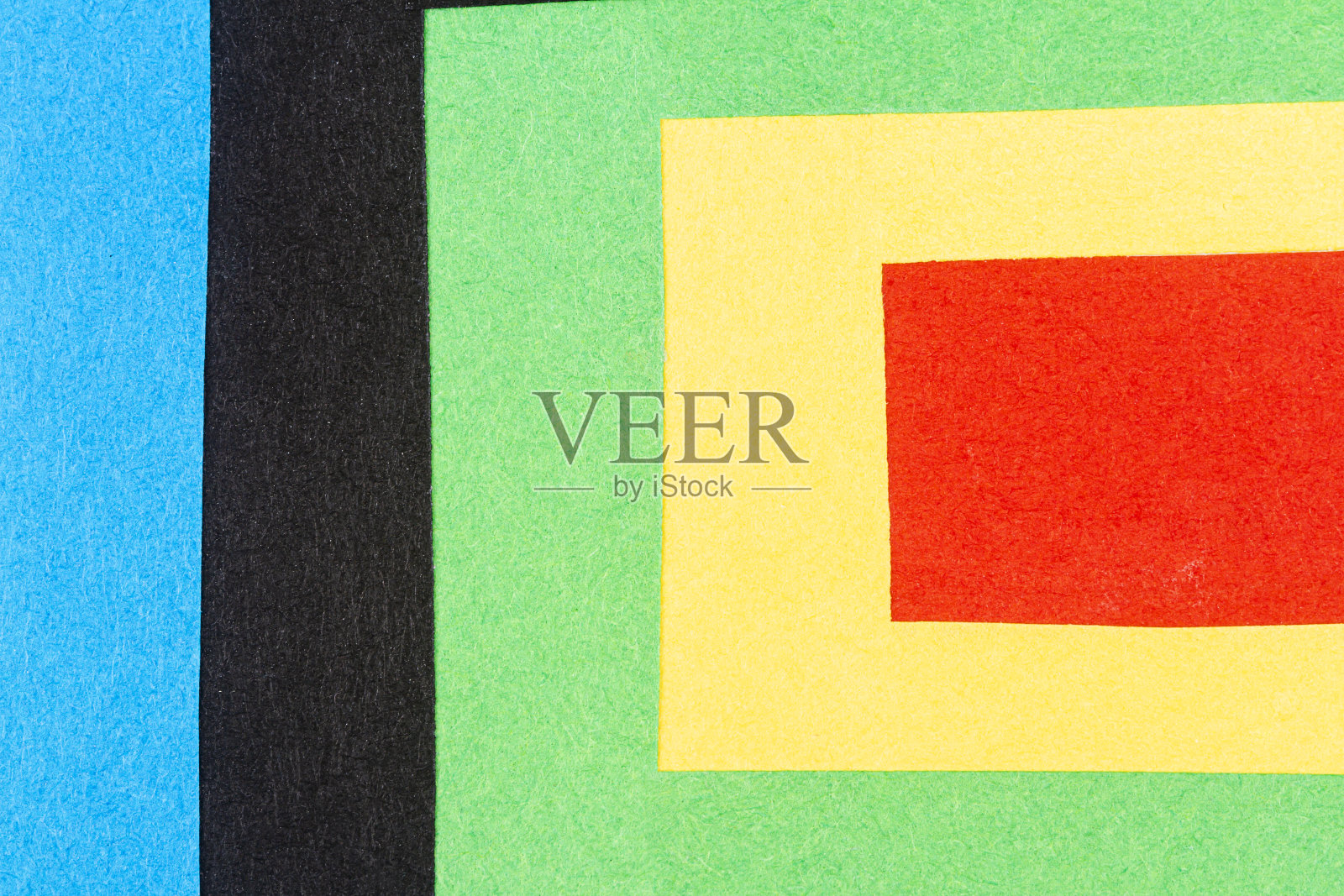 一张不同颜色的纸上的多色背景照片摄影图片