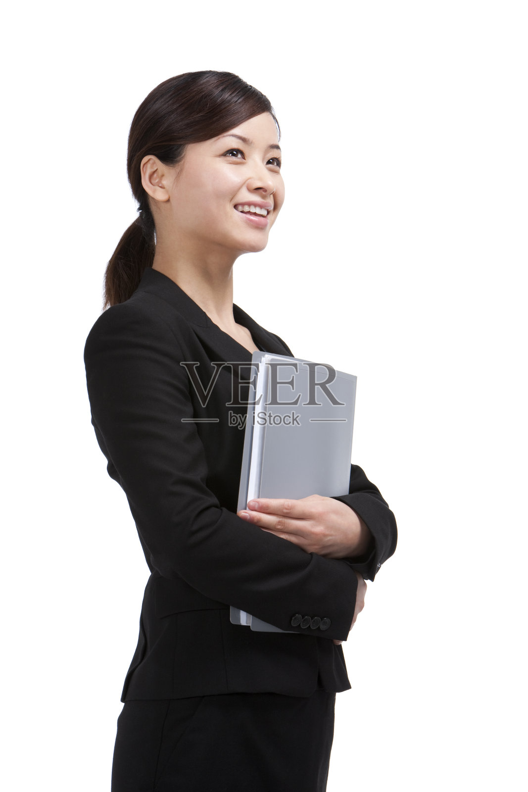 青年商务女士手捧文件夹照片摄影图片