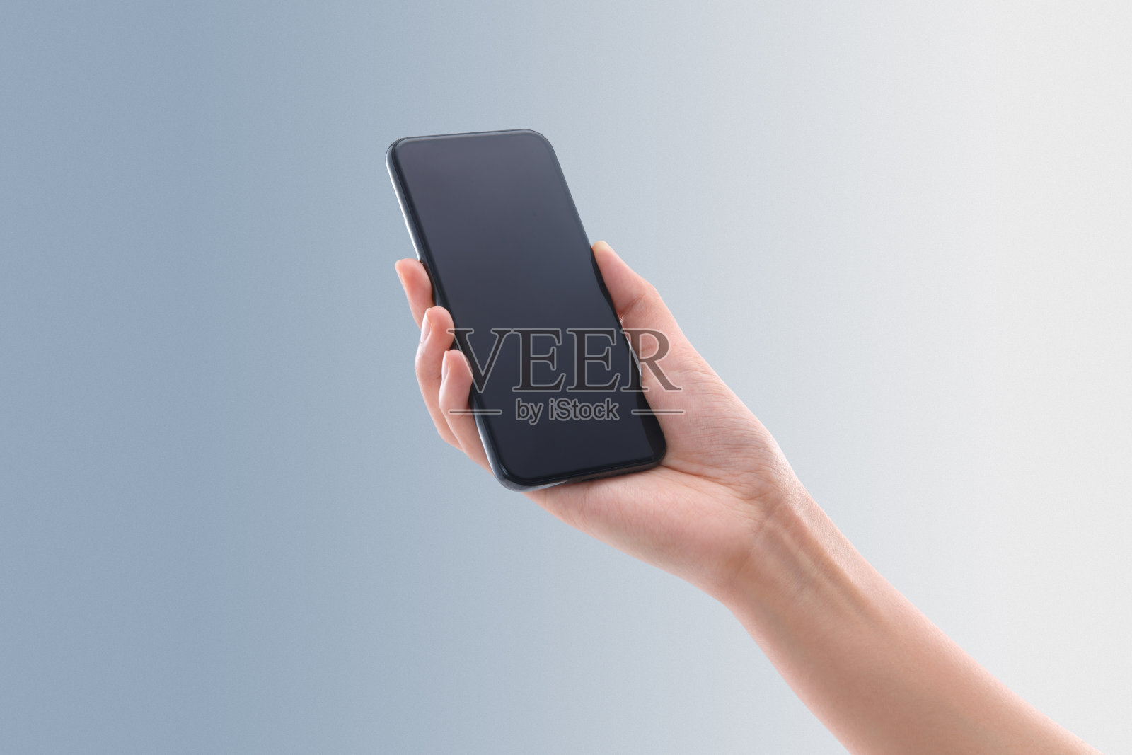 手拿手机照片摄影图片