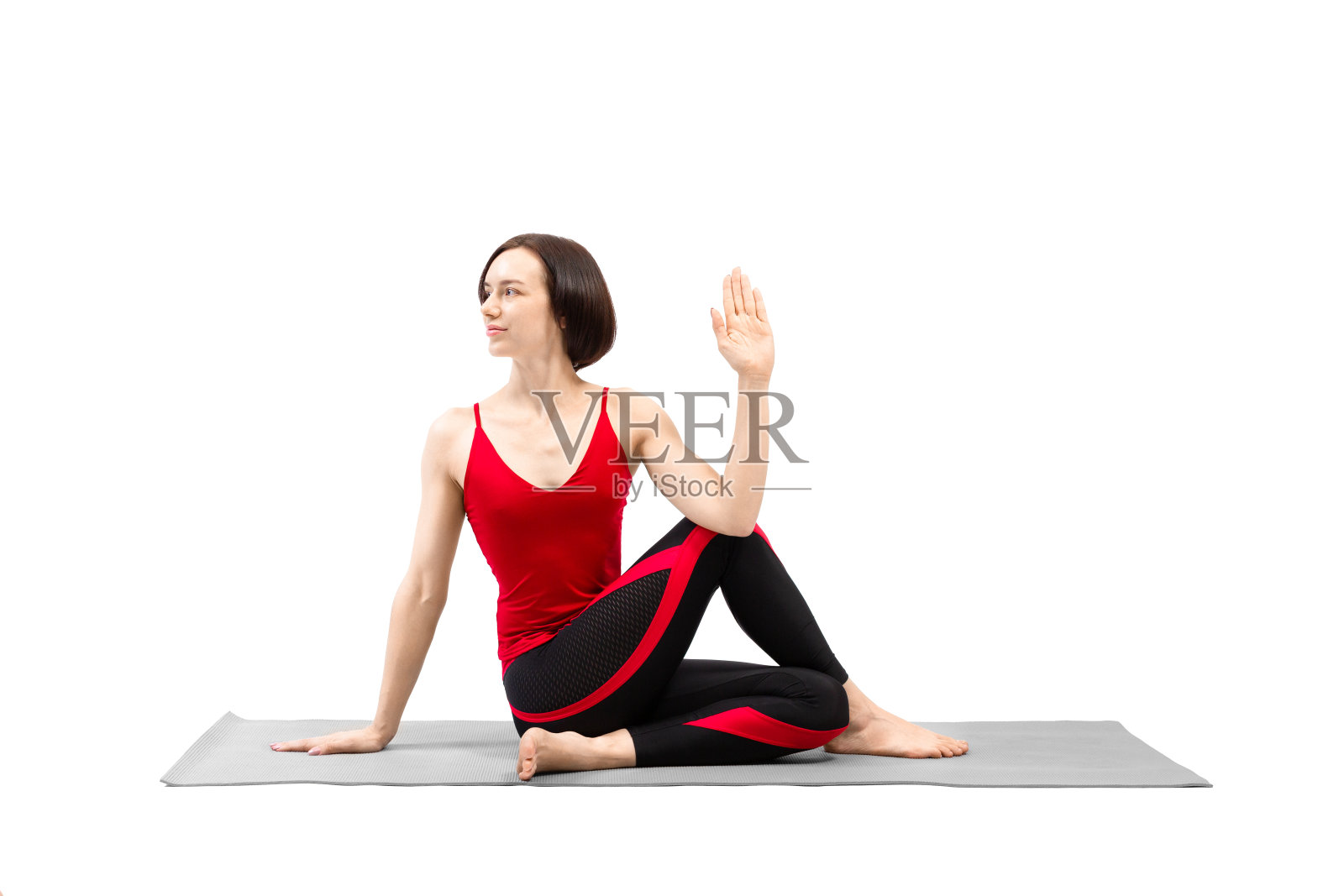 半鱼王瑜伽姿势。有吸引力的女人与理发练习Ardha matsyendrana,孤立在白色。照片摄影图片