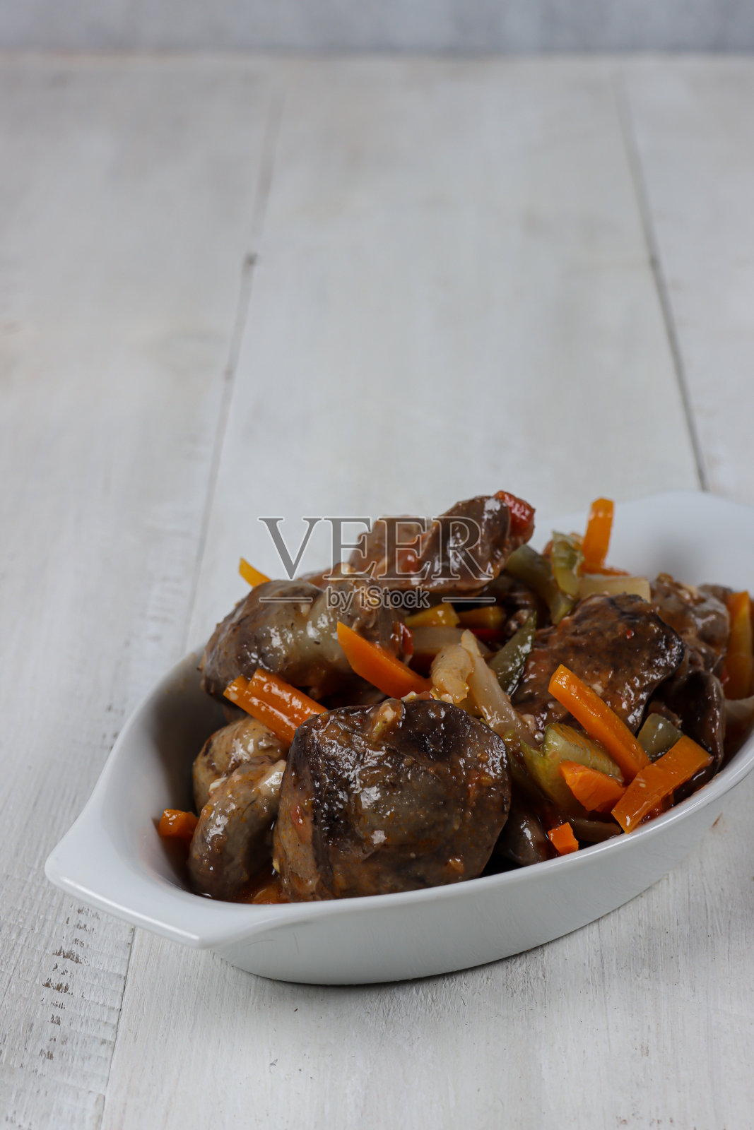 这是我的拿手好菜。糖醋鸡肝肫鸡。照片摄影图片