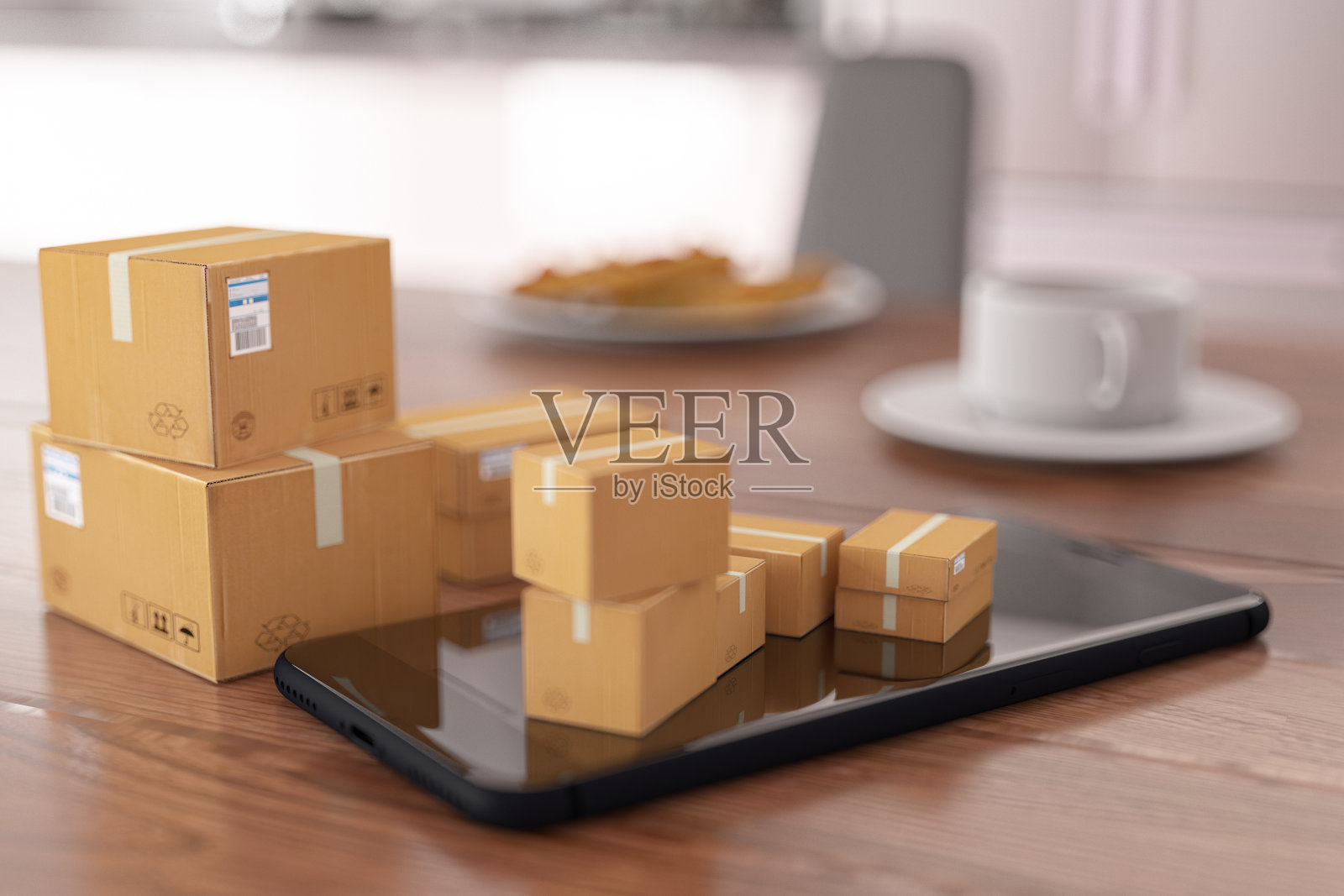 网上购物概念与货物箱在智能手机照片摄影图片