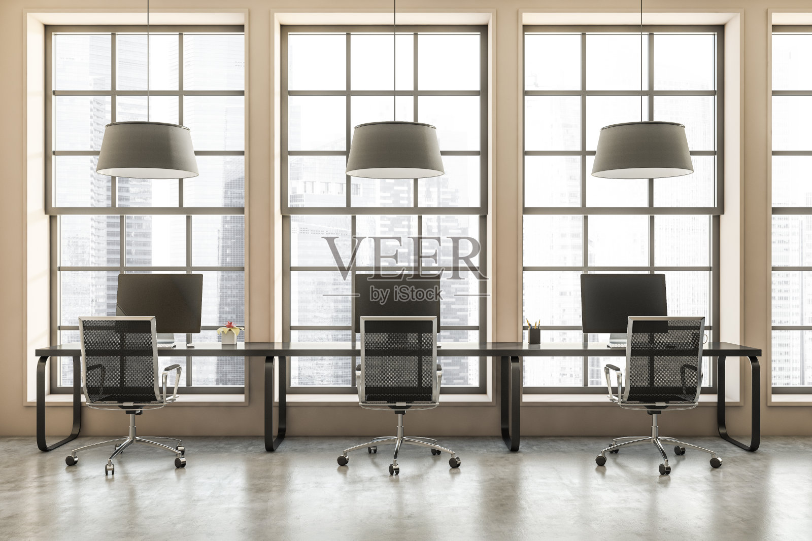 办公室内部设有座位,桌子和电脑,窗户可欣赏城市景观照片摄影图片