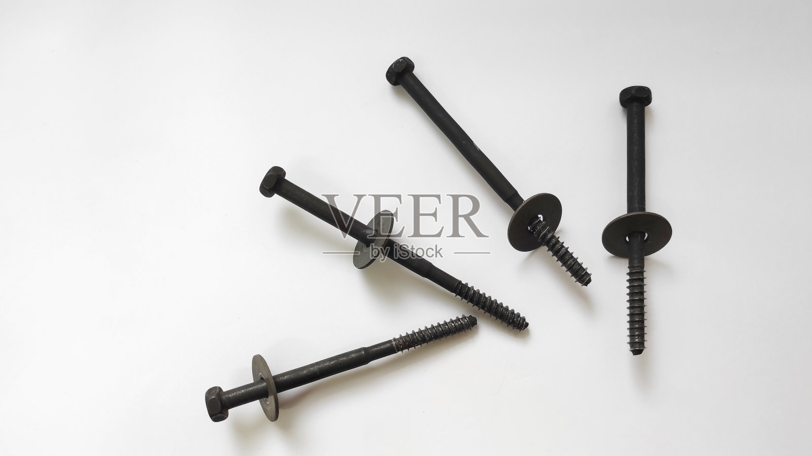 一对白色背景的大螺栓螺母照片摄影图片