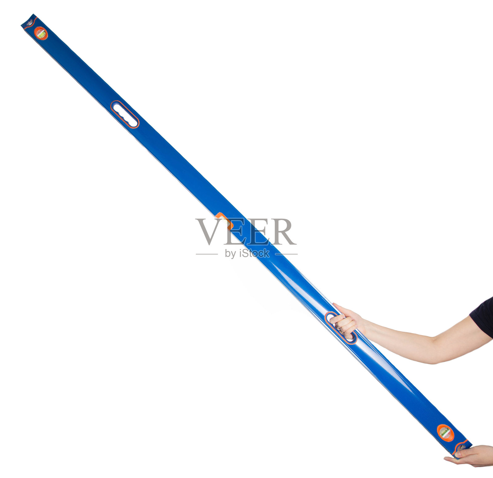 建筑铝水平在一个白色的背景手上。平面测量工具。隔离照片摄影图片