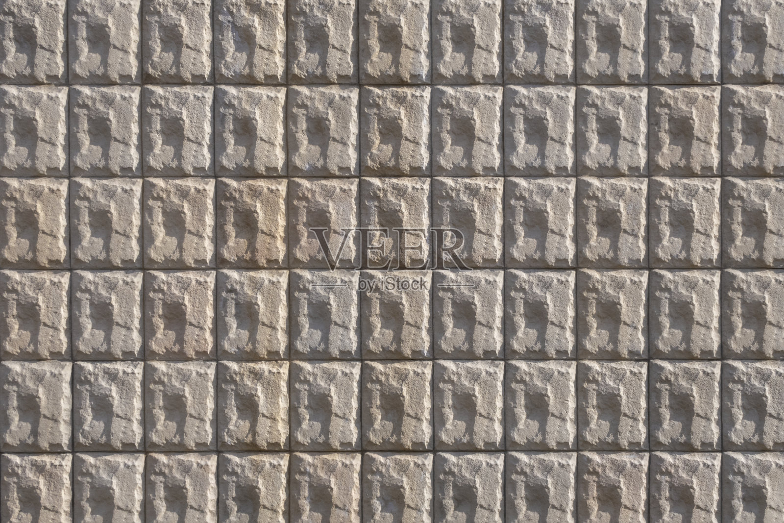 石砌成的图石瓦片。几何背景图像。照片摄影图片