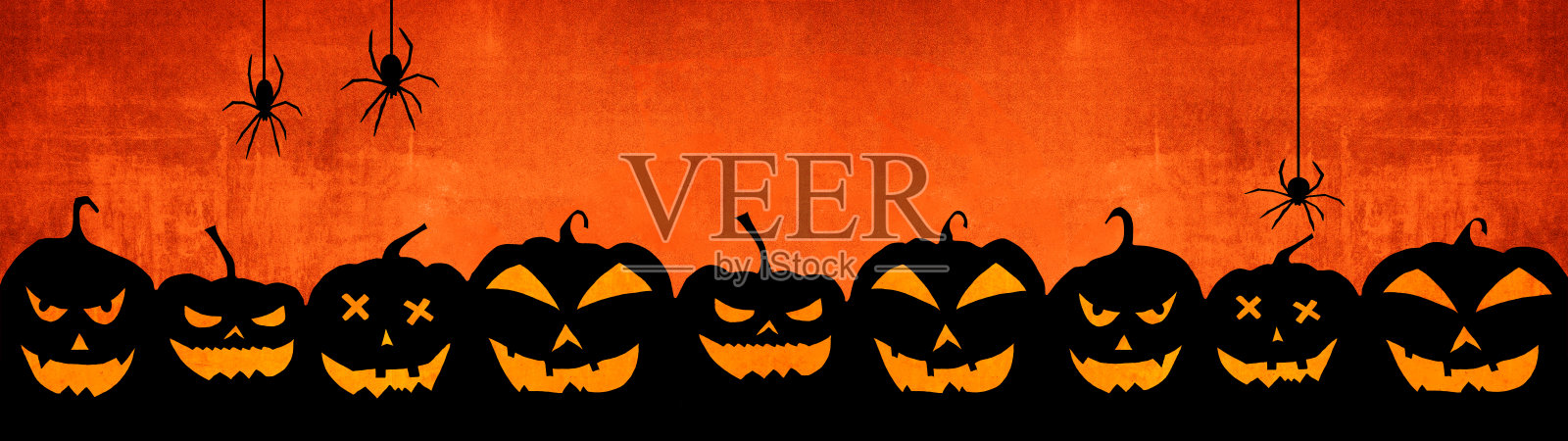 万圣节背景横幅宽全景全景模板-可怕的剪影雕刻夜光卡通南瓜和蜘蛛孤立在黑暗橙色的夜晚纹理照片摄影图片