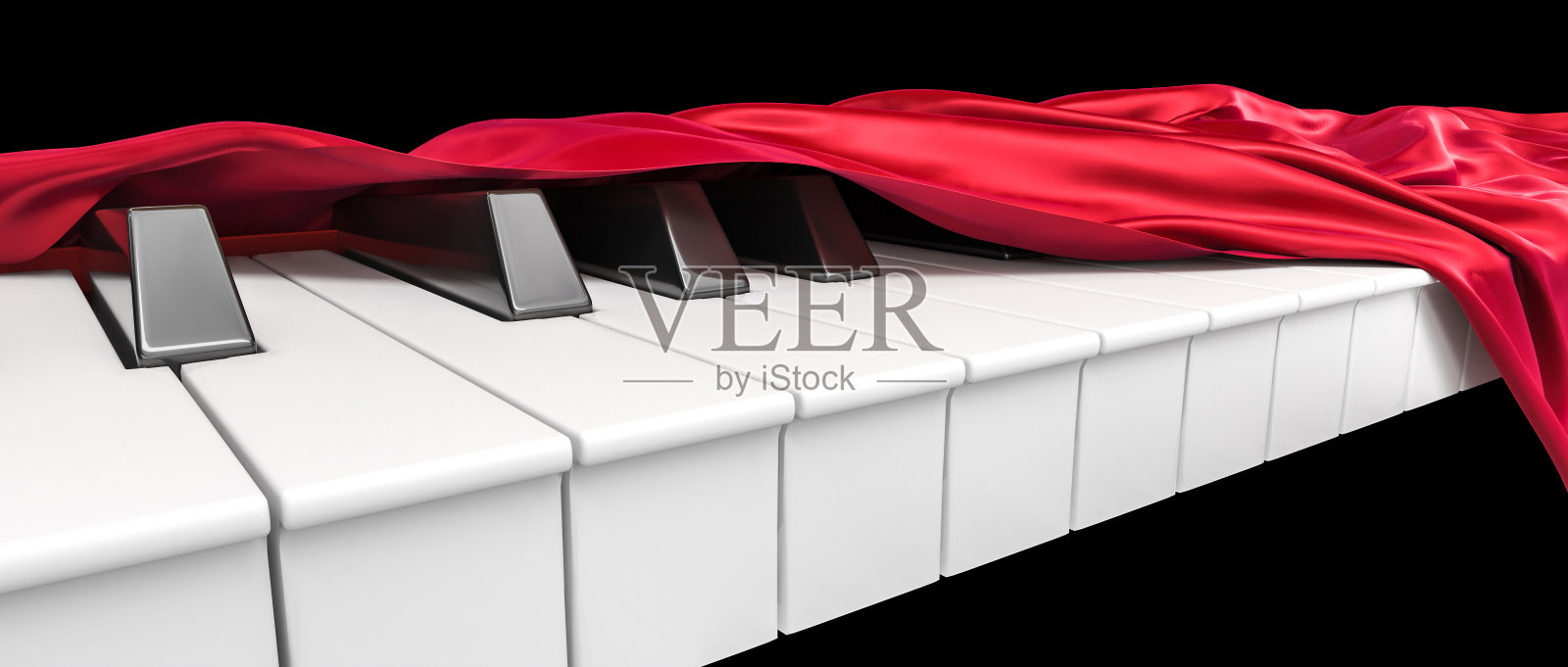 钢琴键盘覆盖红缎子。照片摄影图片