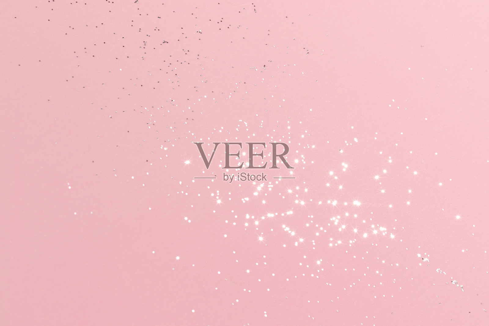 闪闪发光的银色闪光在粉红色的背景照片摄影图片