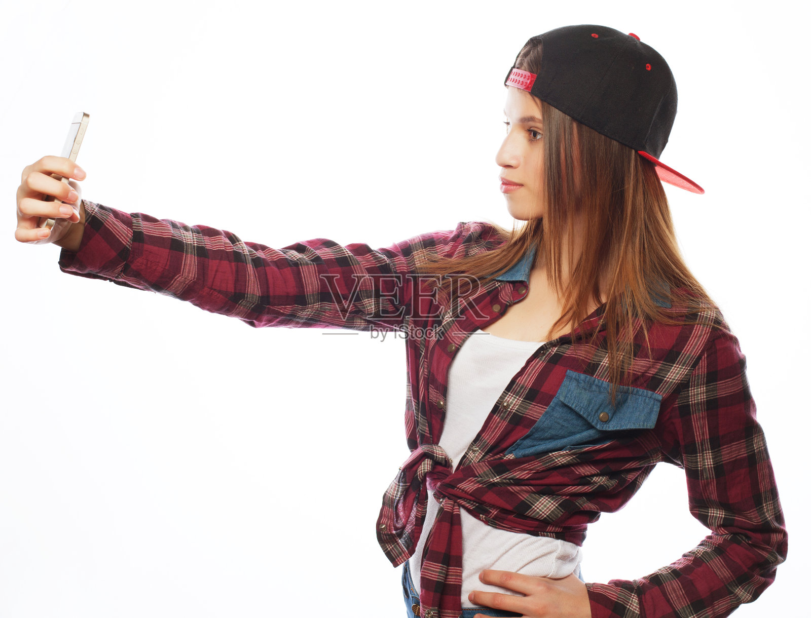 戴着帽子的漂亮少女在自拍照片摄影图片