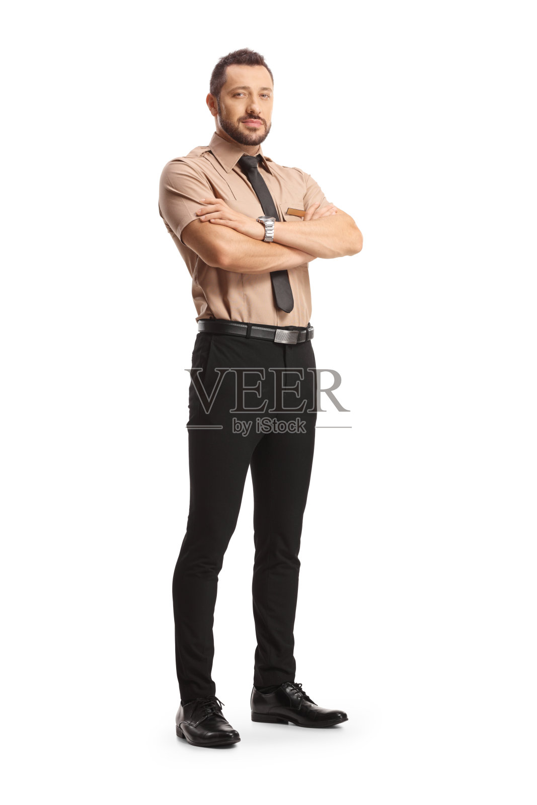 一名年轻保安双臂交叉的全身像照片摄影图片