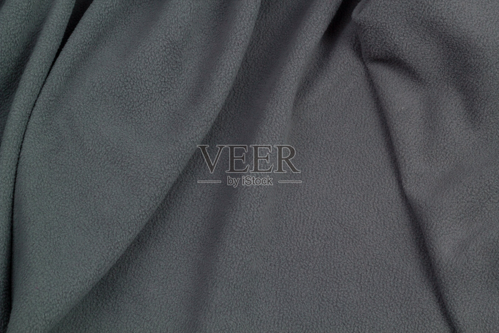 抓绒面料俯视图。纺织羊毛床罩的质地。照片摄影图片