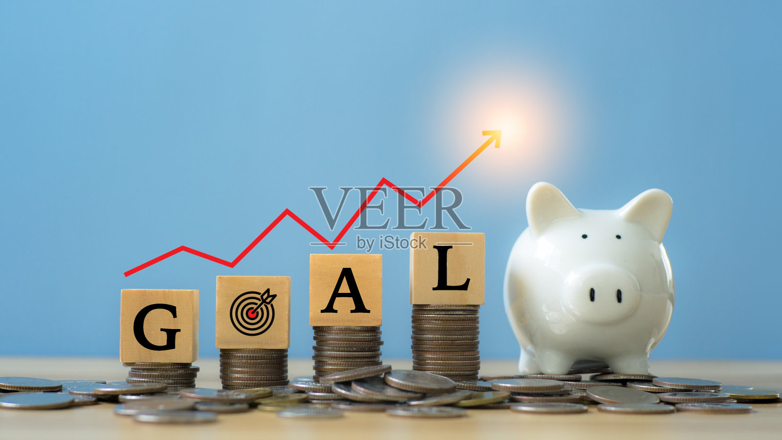 2023年的目标。目标字木方上的硬币。业务增长桌面上有虚拟全息图图表。照片摄影图片