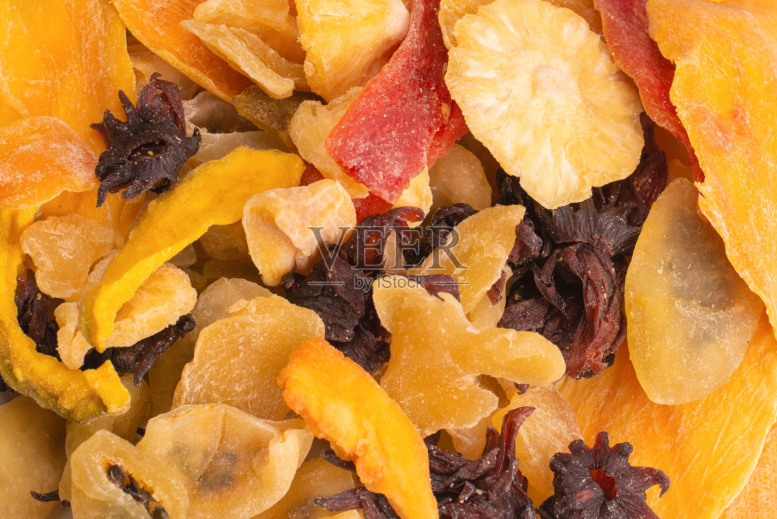 混合干异域水果,芒果,菠萝片,百香果,木瓜。照片摄影图片