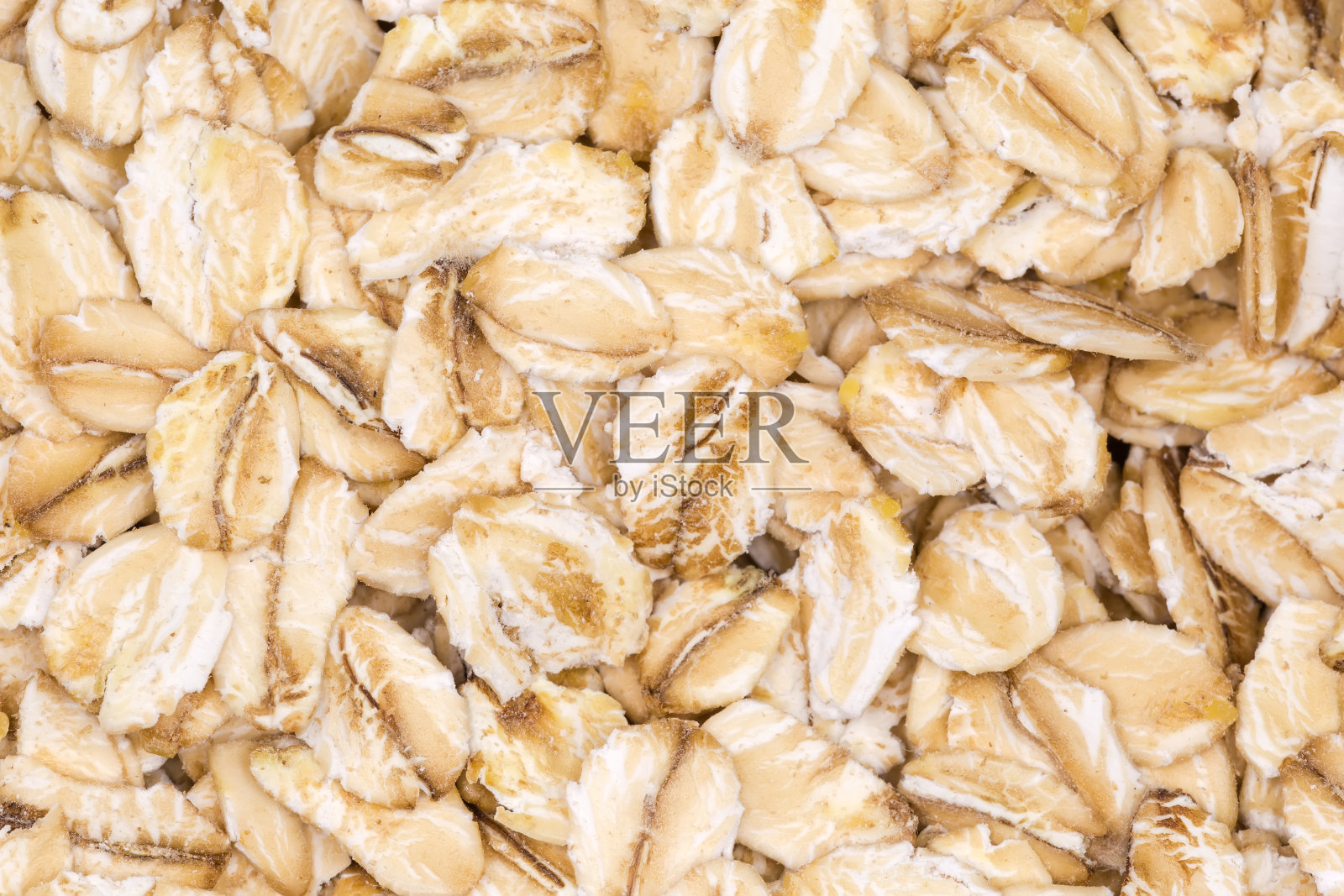 背景是粗卷燕麦的特写照片摄影图片