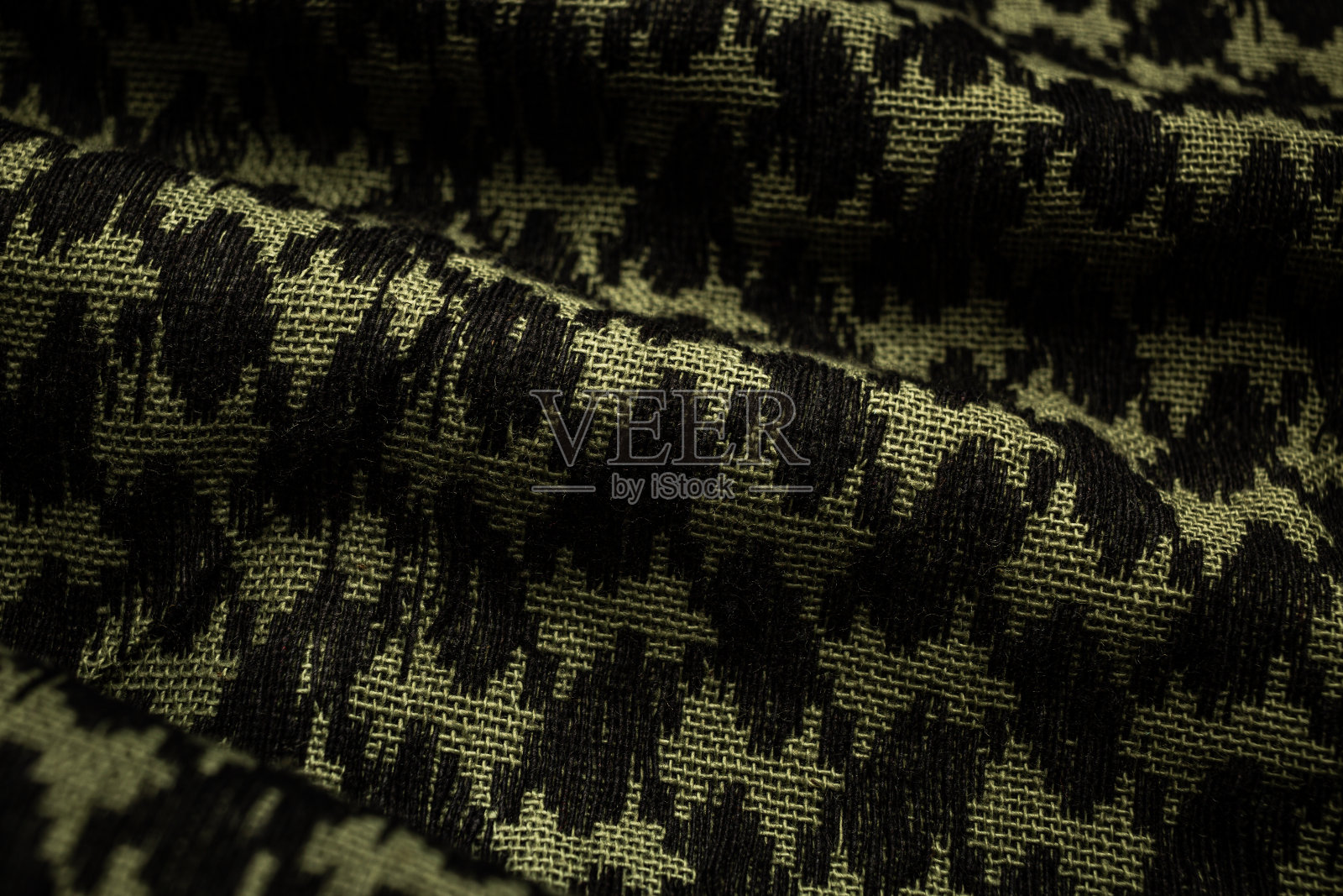 卡夫耶围巾:传统阿拉伯棉质围巾特写,卡其色背景照片摄影图片