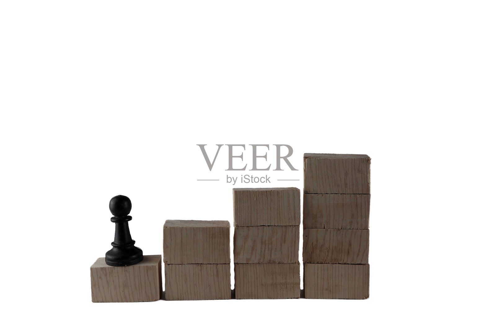 木块上的棋子。一个想要获得最高成功的员工的目标概念照片摄影图片