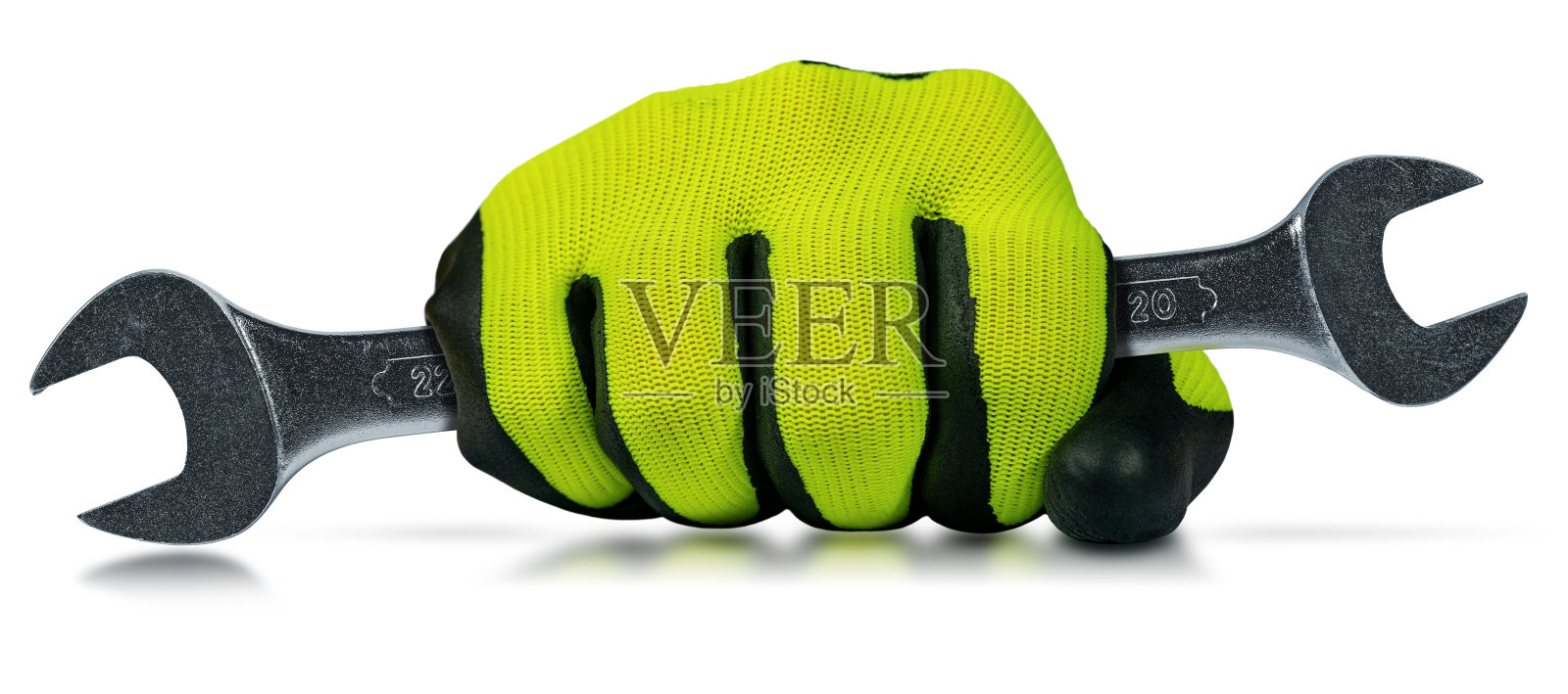 戴手套的手拿着白色背景上的钢扳手照片摄影图片