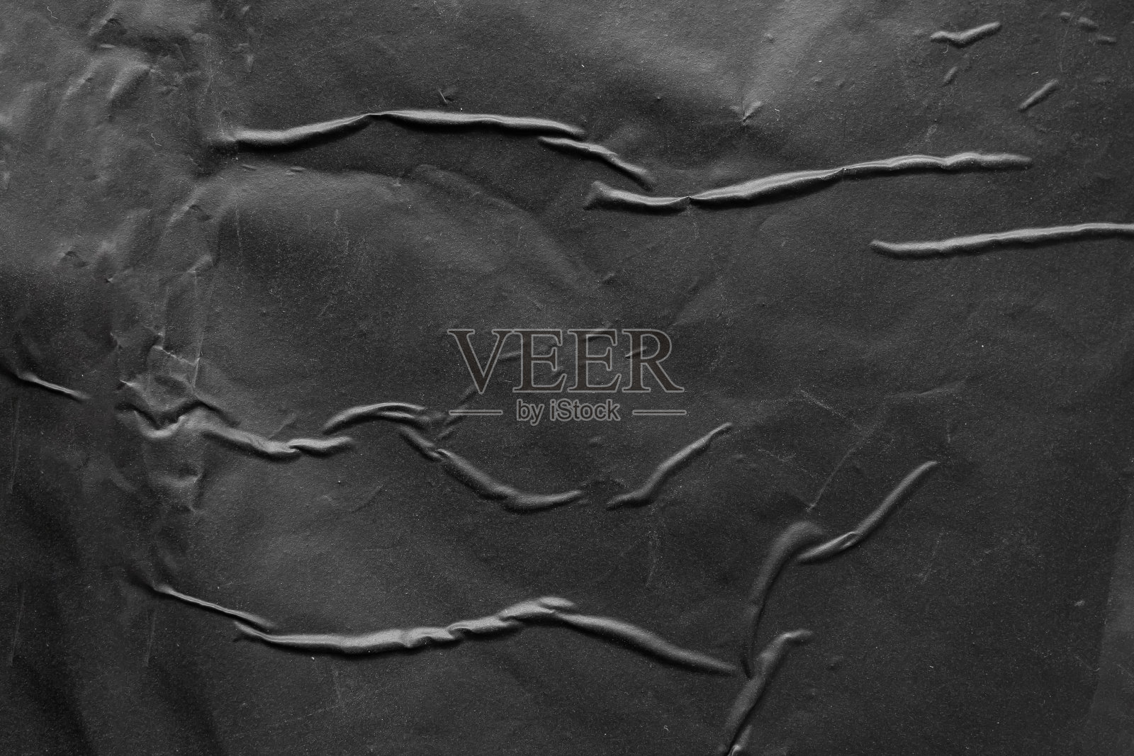 黑色皱褶和折痕塑料海报纹理背景照片摄影图片