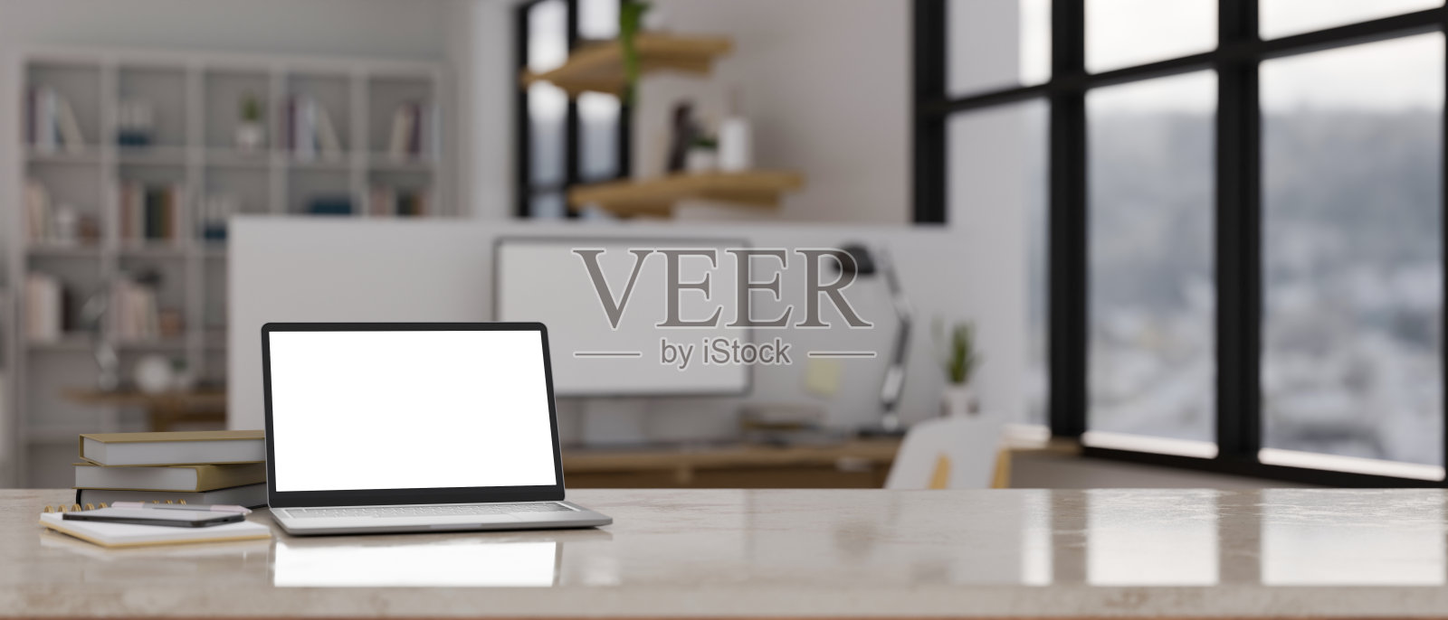 工作区桌面与笔记本电脑模型在模糊的现代城市办公室的背景照片摄影图片