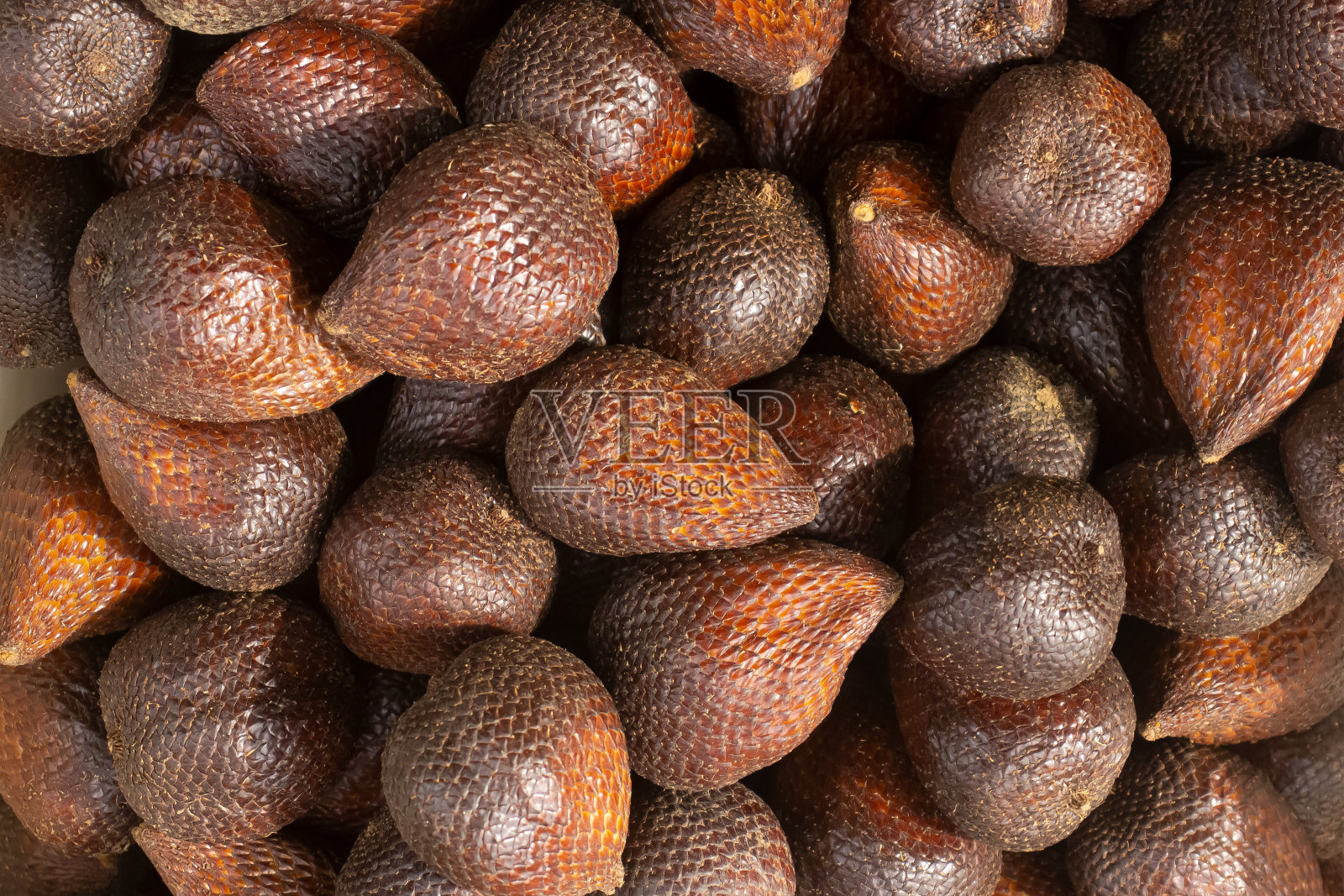 售卖沙拉克水果的商贩,沙拉克水果背景,巧克力沙拉克水果。照片摄影图片