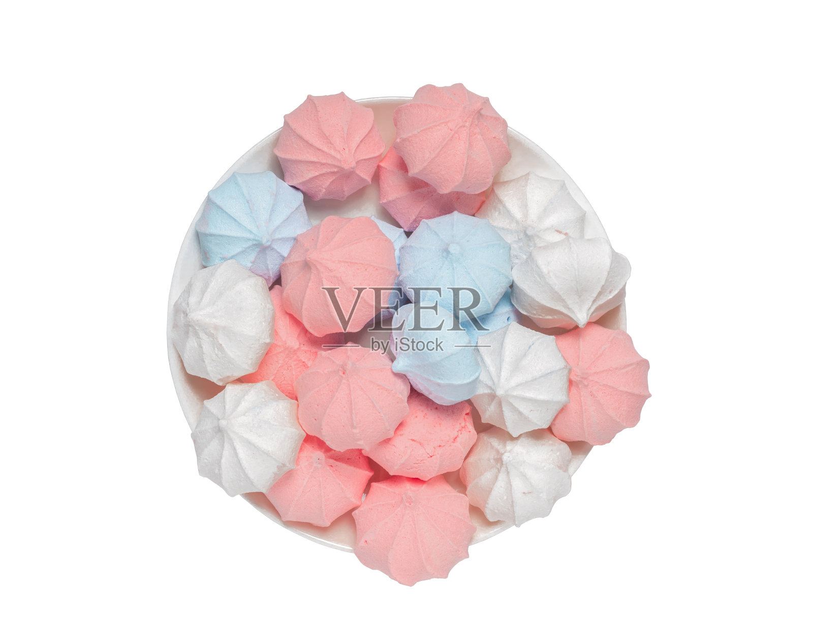 彩色蛋白霜放在盘子里。照片摄影图片