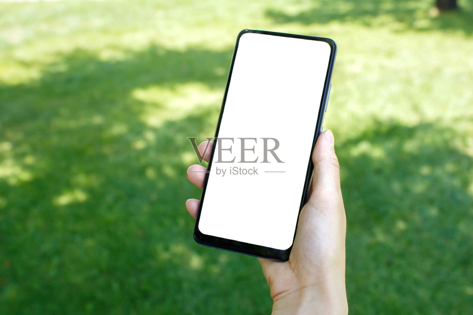 户外手持电话照片摄影图片