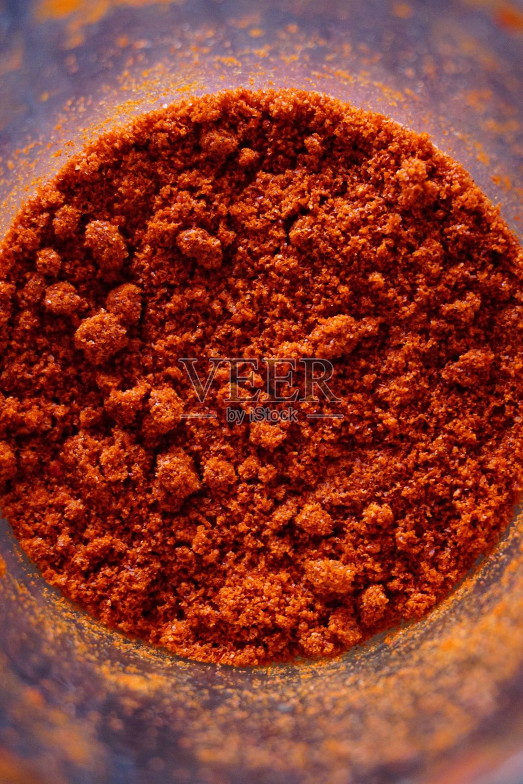 玻璃罐中红辣椒粉的特写照片摄影图片