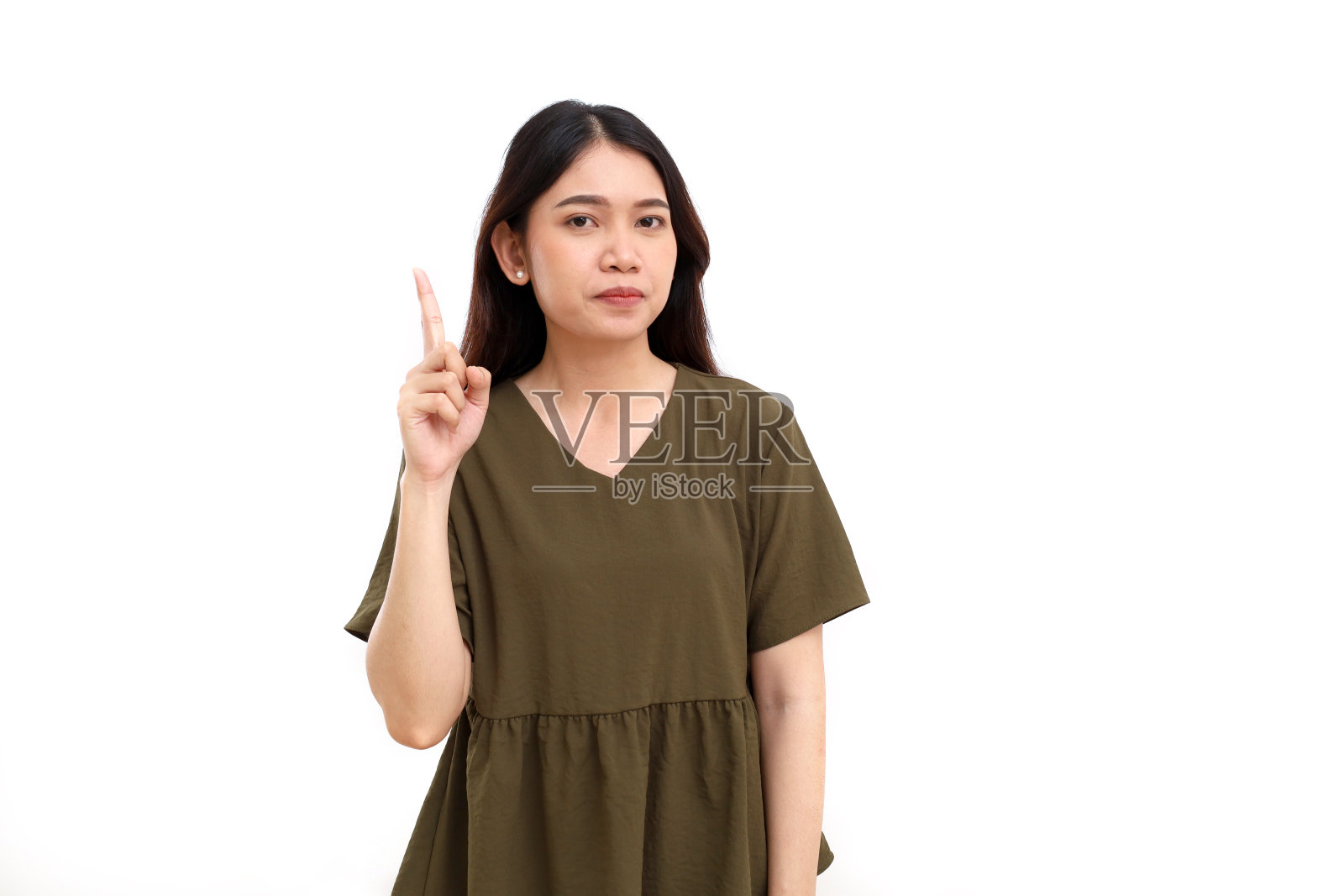 年轻的亚洲妇女站着伸出手指。获得想法和概念。一个或第一个手势。孤立的照片摄影图片